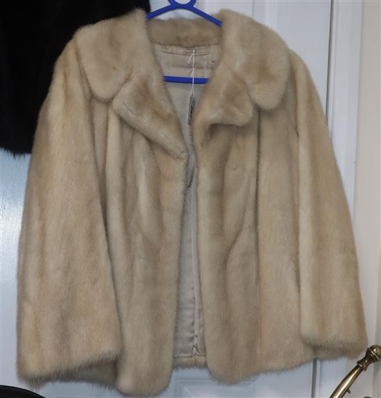 A blonde mink coat, three quarter sleeves, waist length, evening jacket